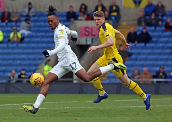 Ivan Toney of Peterborough United in action with Rob Dickie of Oxford United. Picture: Joe Dent