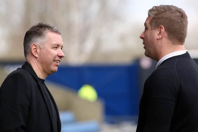 Rival managers Darren Ferguson and Karl Robinson before the game at Oxford. Photo: Joe Dent/theposh.com.