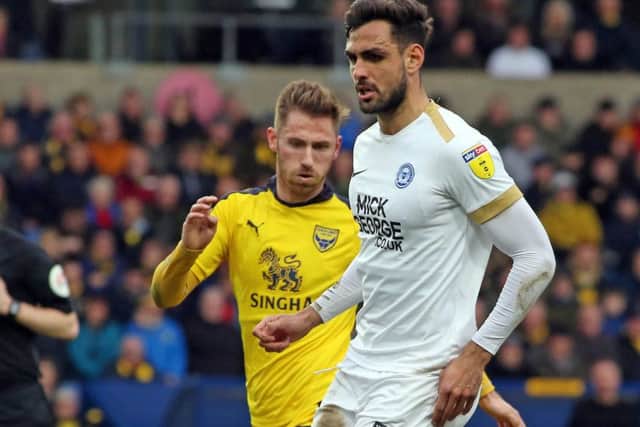 Ryan Tafazolli in action for Posh against Oxford's James Henry.  Photo: Joe Dent/theposh.com.