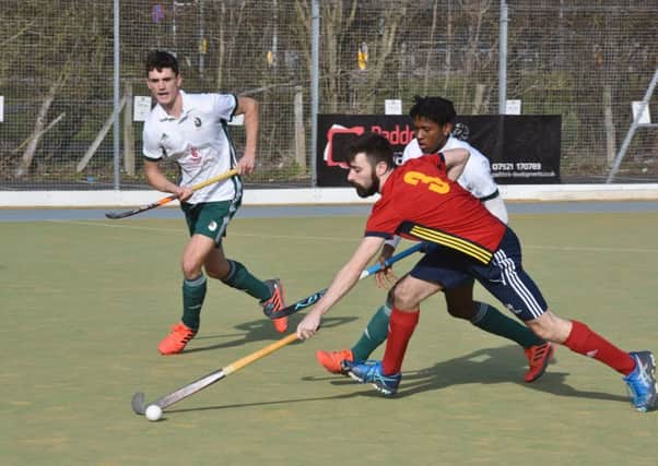 Ben Newman (red) in action for City of Peterborough against Canterbury. Photo: David Lowndes.