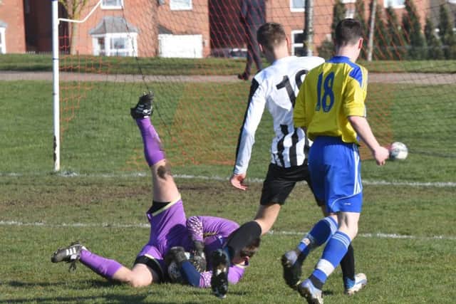 Action from the game between Hempsted Under 18s and Oundle Town.