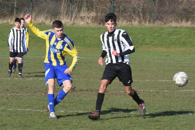 Action from the game between Hempsted Under 18s and Oundle Town.