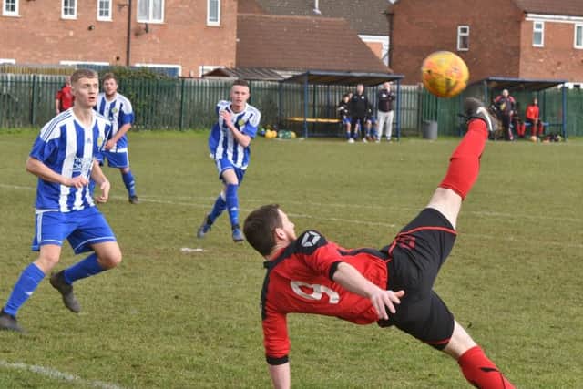 Action from Peterborough Sports Development's (blue) 5-1 win over Netherton United. Photo: David Lowndes.