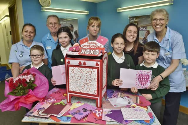 Sue Ryder staff receive Valentine's cards and  flowers from: Tyler Hopkins, Tara Williams, Olivia Jeffrey and Ethan Love EMN-190213-150307009