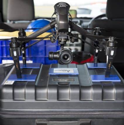Safely in the back of the vehicle, two of the drones used by Fly2View