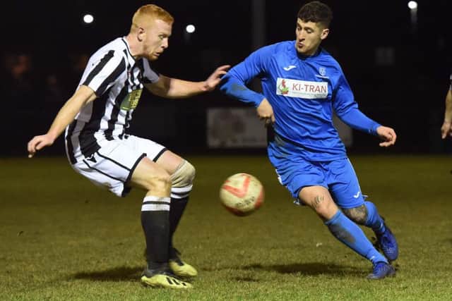 Herbie Panting of Peterborough Northern Star (stripes) in action against Cogenhoe United. Photo: Chantelle McDonald. @Cmcdphotos.