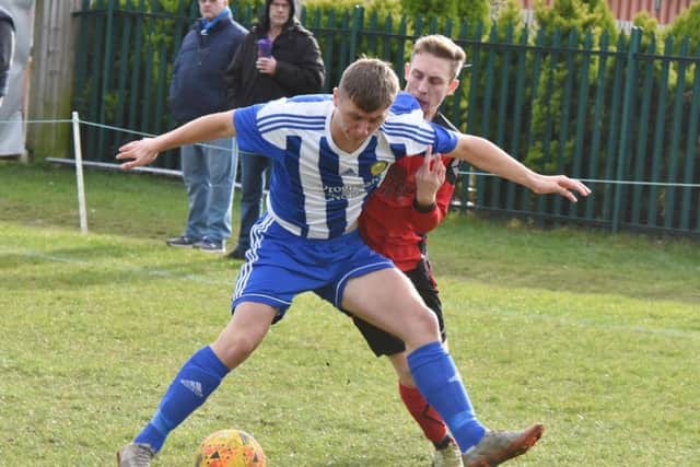 Action from a 5-1 win for Peterborough Sports Development (blue) over Netherton United last weekend. Photo: David Lowndes.