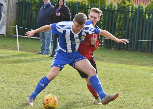 Action from a 5-1 win for Peterborough Sports Development (blue) over Netherton United last weekend. Photo: David Lowndes.