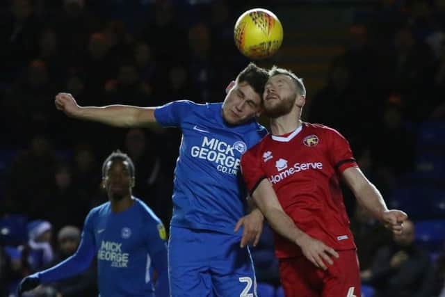 Matty Stevens (blue) playing for Posh against Walsall in December.