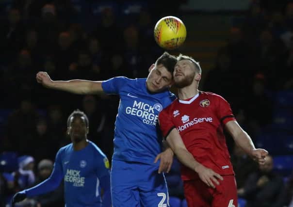 Matty Stevens (blue) playing for Posh against Walsall in December.