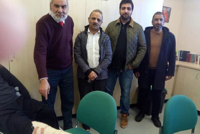 From left: Muhammad Saeeds broken ankle, Ansar Ali and taxi drivers Bashir Badar, Jameel Rehman and Tanvir Ali
