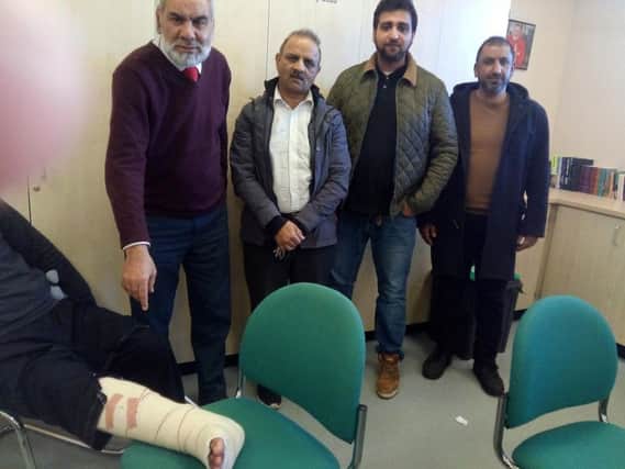 From left: Muhammad Saeeds broken ankle, Ansar Ali and taxi drivers Bashir Badar, Jameel Rehman and Tanvir Ali
