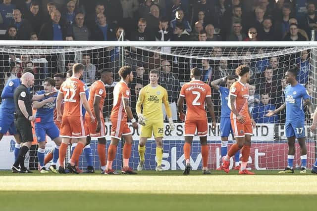 Posh striker Ivan Toney (right) is about to get sent off in the game against Shrewsbury. Photo: David Lowndes.