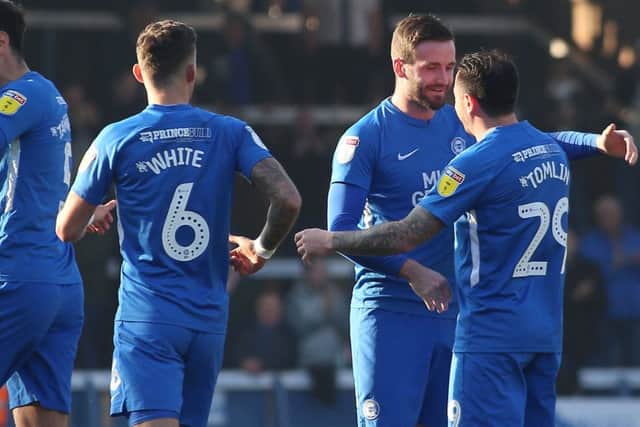 Jason Naismith (second right) celebrates his goal for Posh against Shrewsbury. Photo: Joe Dent/theposh.com.