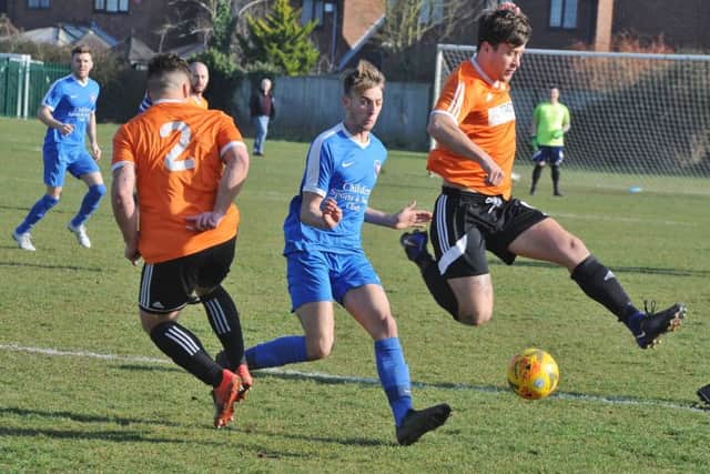Action from the Cambs Cup semi-final between Thorney and Whittlesey Athletic (blue). Photo: David Lowndes.
