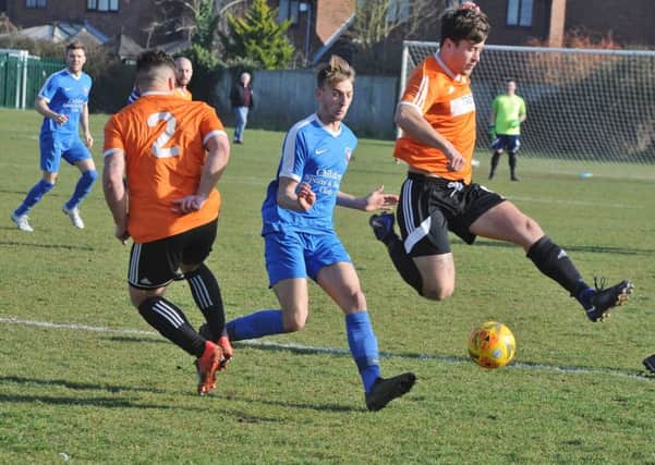 Action from the Cambs Cup semi-final between Thorney and Whittlesey Athletic (blue). Photo: David Lowndes.