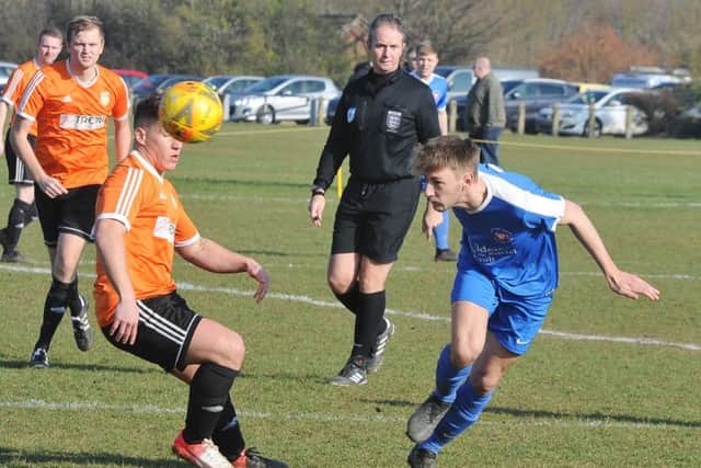 Action from Whittlesey Athletic's 2-1 Cambs Cup semi-final at Thorney (orange). Photo: David Lowndes.
