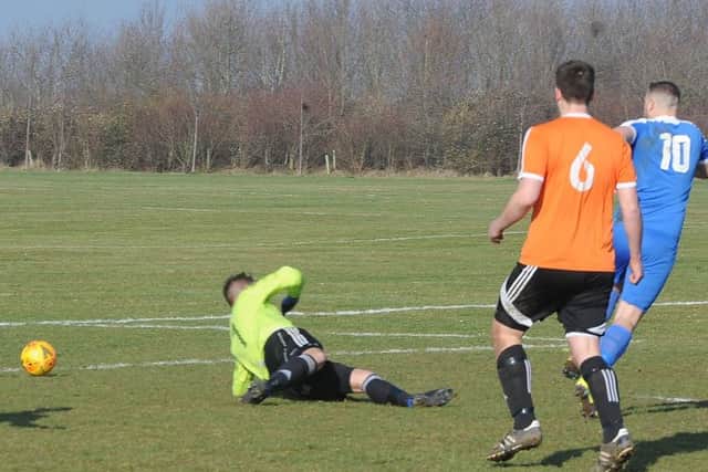 Matt Heron (10) opens the scoring for Whittlesey Athletic at Thorney. Photo: David Lowndes.