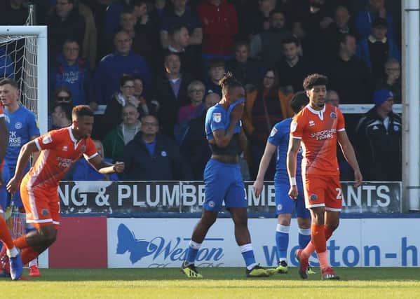 Ivan Toney of Peterborough United leaves the pitch dejected after being sent-off against  Shrewsbury Town.