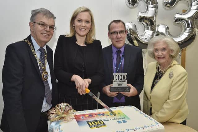 From left, Mayor of Peterborough Cllr Chris Ash, Coloplast's Annemarie van Neck, Coloplast business support director Myles Davies and Mayoress of Peterborough Doreen Roberts cut a cake to celebrate the firm's success.