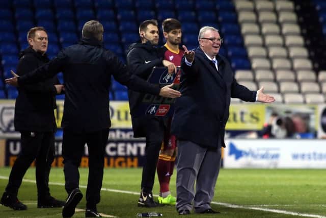 Posh manager Steve Evans appeals for a decision during a game against Bradford City.