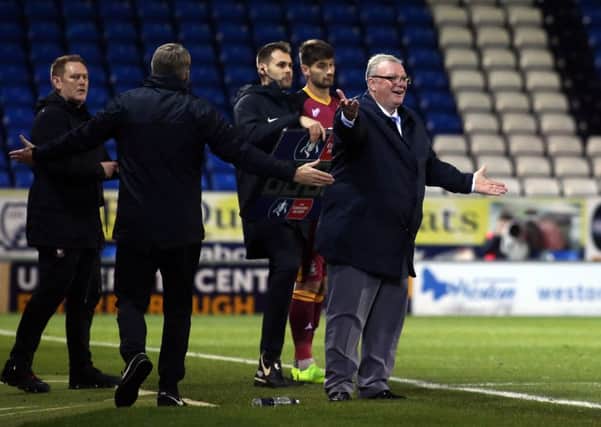 Posh manager Steve Evans appeals for a decision during a game against Bradford City.