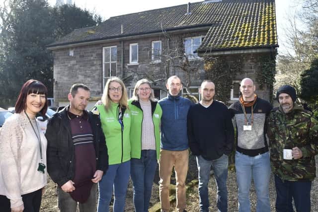 Staff, volunteers and guests outside Garden House in the Cathedral Precincts