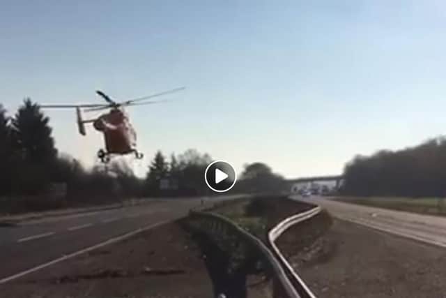 The Magpas air ambulance taking off from the A1 at Little Paxton