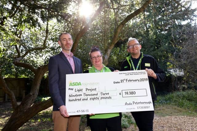 The cheque presentation at Garden House, Peterborough. From left: Steven Pettican (Light Project Peterborough), Diane Munns (Asda community champion) and Brian Bell (Asda Peterborough fresh section manager)