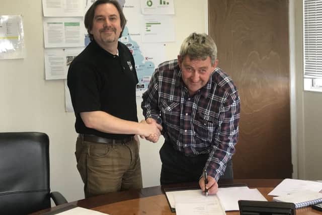 Keith Chapman (right) with East of England Arena manager Jason Lunn after signing the clubs contract to race at the venue this season
