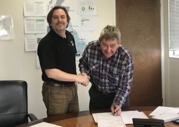 Keith Chapman (right) with East of England Arena manager Jason Lunn after signing the clubs contract to race at the venue this season