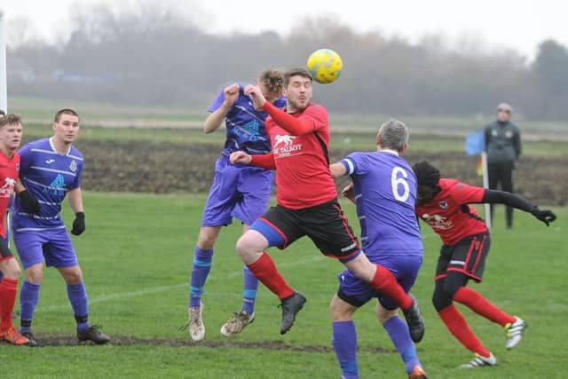 Stilton United (red) in action.