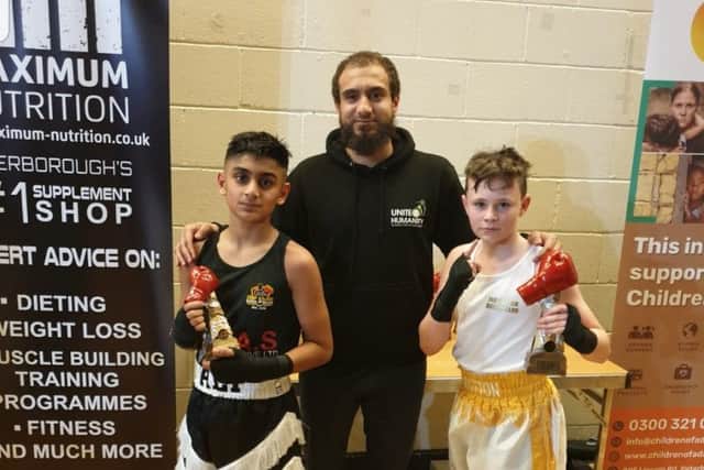 The Unite 4 Humanity best runner-up award went to Saif Ali who is pictured with opponent Nial Tee.