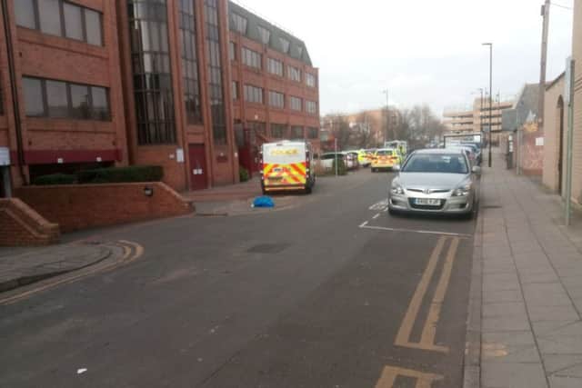 Police investigating in Priestgate near where the men were arrested
