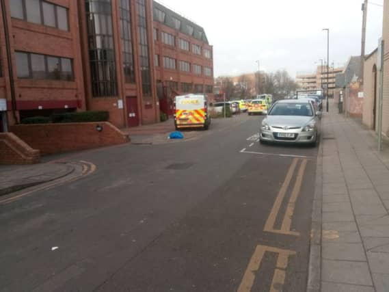 Police investigating in Priestgate near where the men were arrested