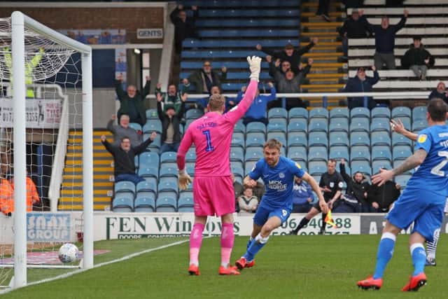 Matt Godden of Peterborough United celebrates scoring the opening goal of the game. Picture: Joe Dent