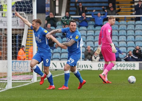 Matt Godden of Peterborough United celebrates scoring the opening goal of the game. Picture: Joe Dent