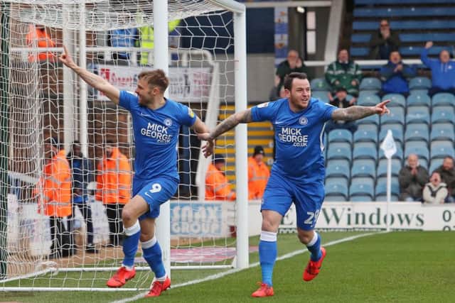 Matt Godden of Peterborough United celebrates scoring the opening goal of the game. Picture: Joe Dent