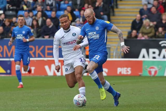 Marcus Maddison of Peterborough United in action with Curtis Thompson of Wycombe Wanderers. Picture: Joe Dent