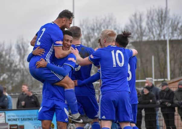 Peterborough Sports players celebrate scoring against Corby. Picture: James Richardson