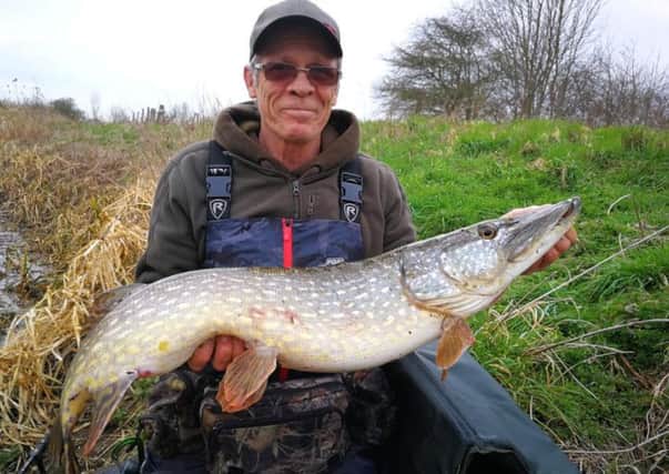 Carl Street with a cracking 18lb pike.