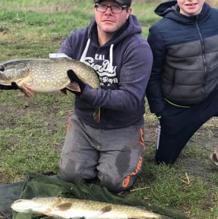 Lee Covell and nephew Kieran Nicholl with a good catch from the Ramsey Forty Foot.