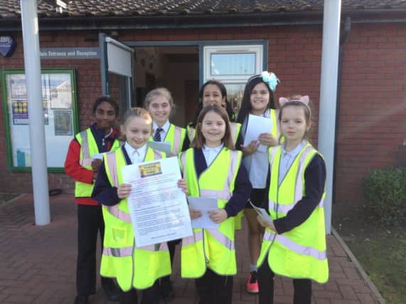 Pupils at Longthorpe Primary School with their leaflets