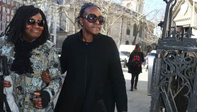 Disgraced MP Fiona Onasanya (right) arrives outside The Royal Courts of Justice for her conviction challenge with an unidentified woman  The Peterborough MP was jailed for three months after being found guilty of perverting the course of justice by lying to police to avoid a speeding charge. PRESS ASSOCIATION Photo. Picture date: Tuesday March 5, 2019. See PA story COURTS Onasanya. Photo credit should read: Yui Mok/PA Wire EMN-190503-110553001