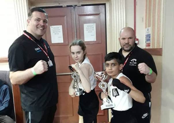 Pictured at a show in Leicester on Sunday are from the left coach, Leighton Morgan , boxers Emily Anderson and Rushaan Raja and coach Mark Dane.