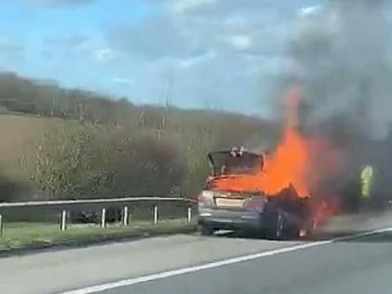 The Mercedes on fire on the A1M at Sawtry. Photo: Matt Galloway
