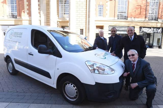 Cllrs Howard Fuller, Mohammed Farooq, Marco Cereste and John Holdich with an Aragon Direct Servicea van in Bridge Street