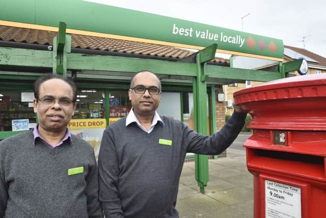 Subramaniam Nithythasan and Subramaniam Nithaharan at the store