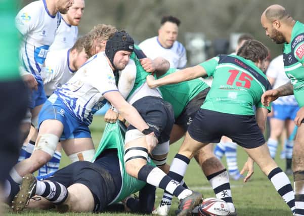 Lions skipper Conor Gracey gets stuck in against Preston Grasshoppers. Picture: Mick Sutterby