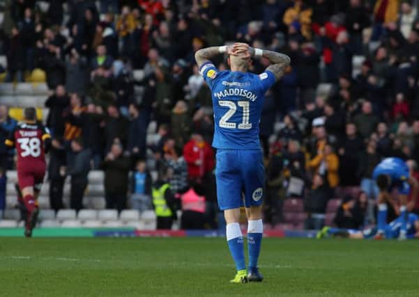 Marcus Maddison puts his head in his hands after Bradford City go 2-0 up against Posh. Photo: Joe Dent/theposh.com.